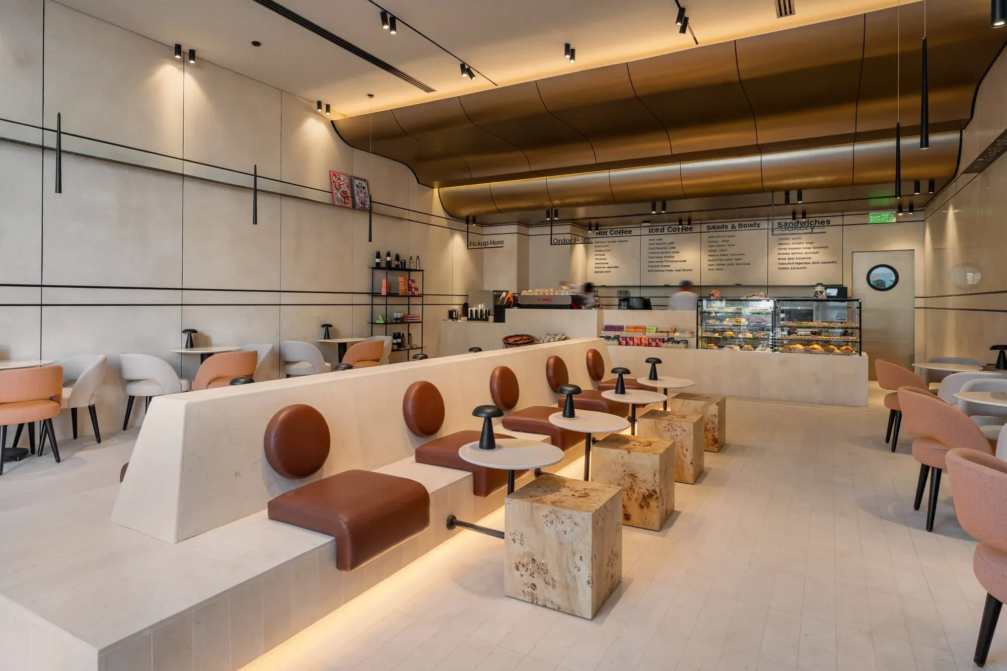 Seating area showing leather chairs and apple veneer booth details