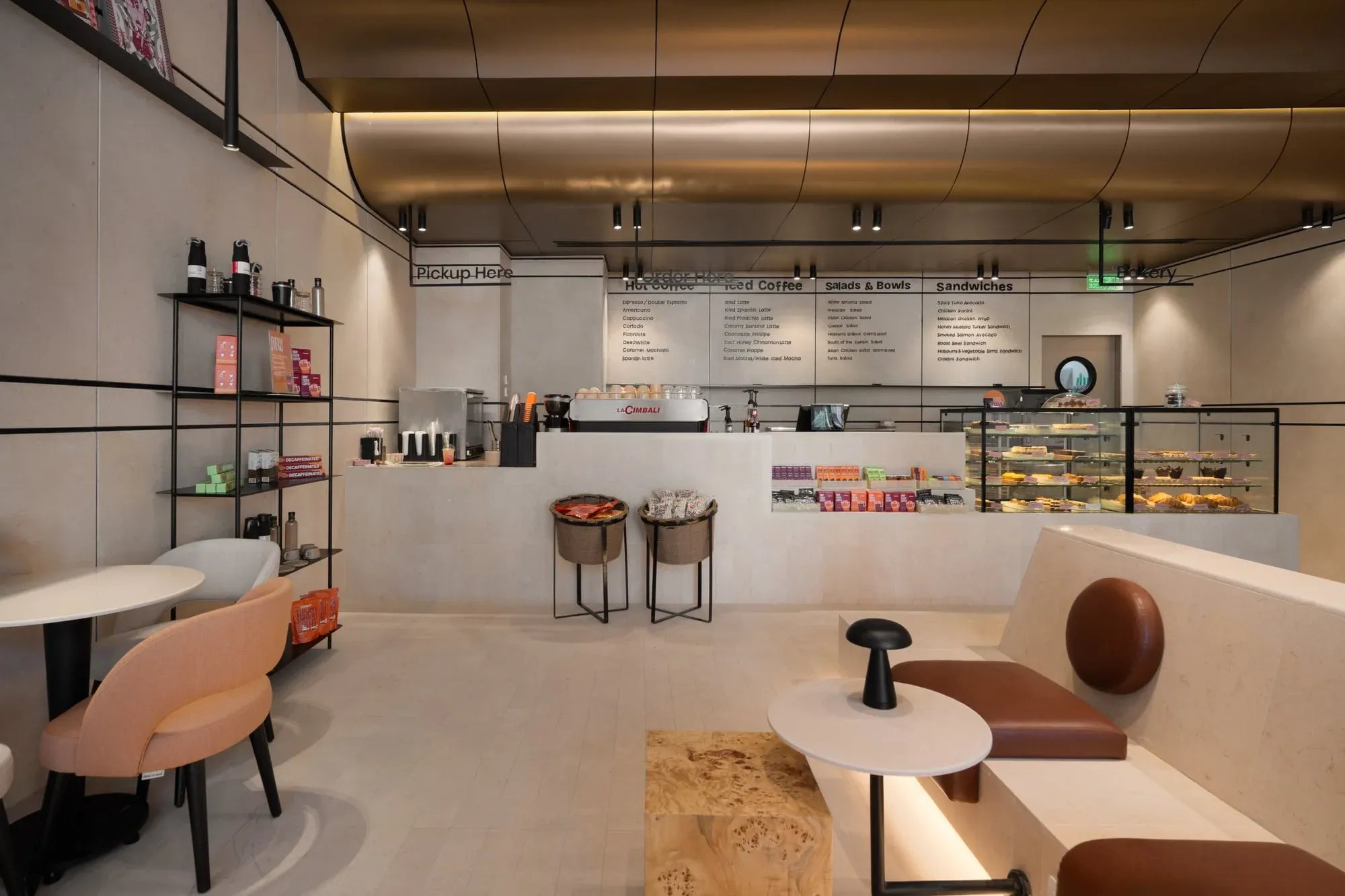 Detail shot of ceiling curves showing lighting integration and stainless steel finish