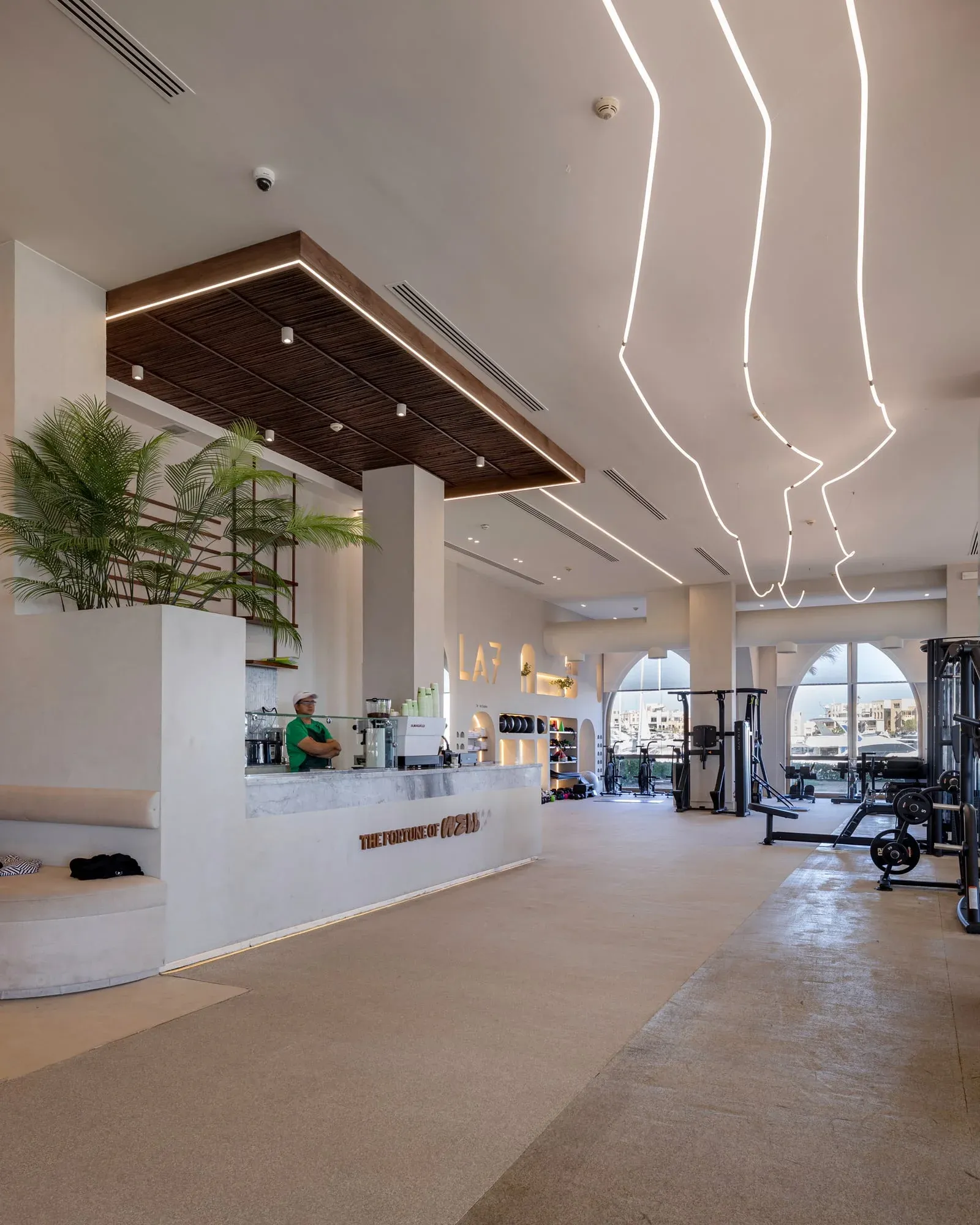 Main entrance featuring massive teak doors with weather treatment finish